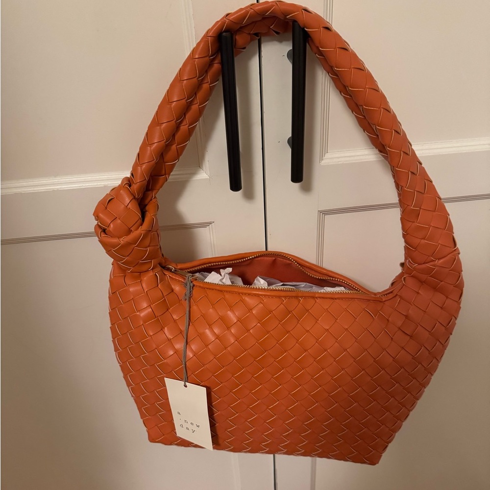 NWT orange woven purse with knot detail in strap